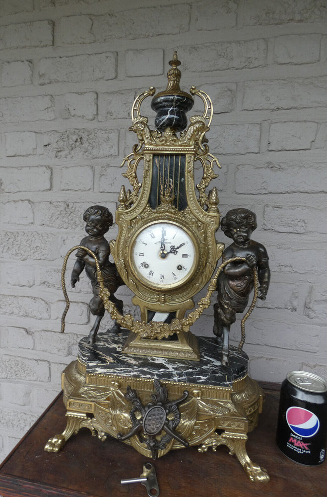 Italian  black marble bronze faun putti figural mantel clock 1970 rare top piece
