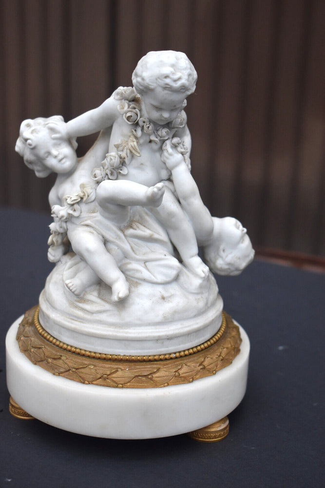 Antique bisque porcelain putti group statue playing marble base