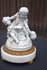 Antique bisque porcelain putti group statue playing marble base
