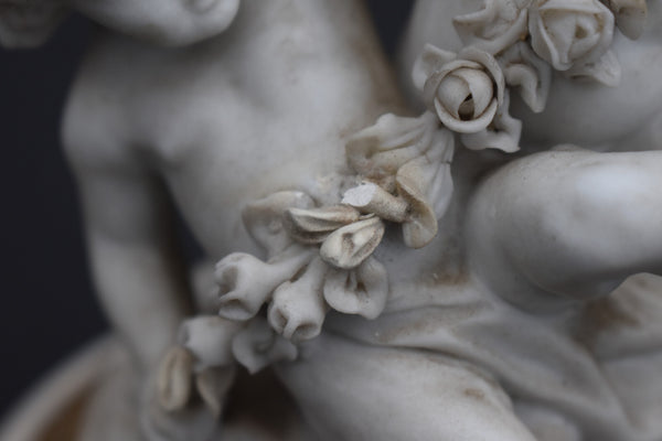 Antique bisque porcelain putti group statue playing marble base