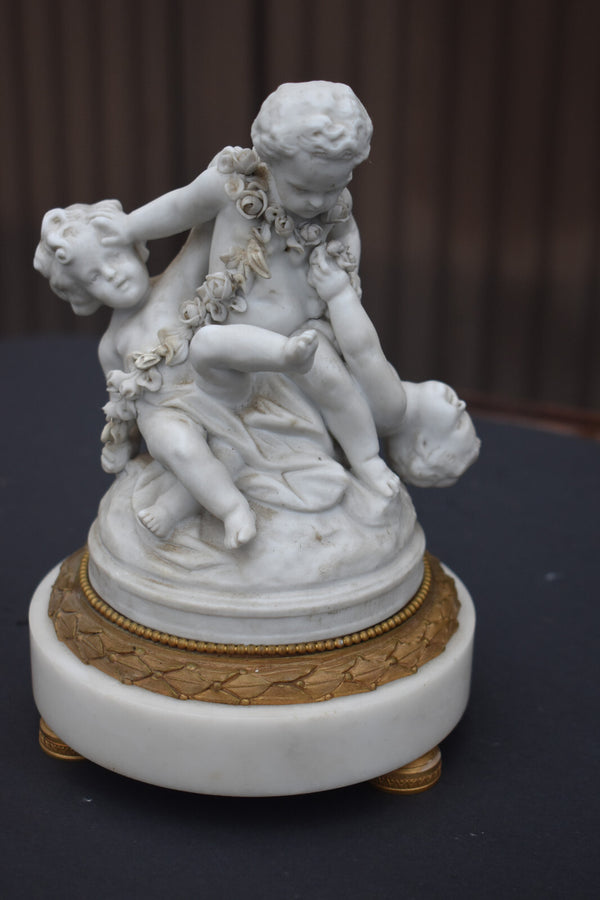 Antique bisque porcelain putti group statue playing marble base