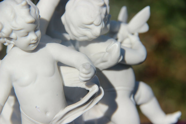 Antique French bisque porcelain putti cherub group