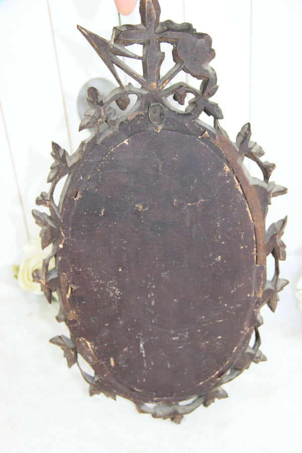 A Large antique napoleon III black forest wood carved crucifix velvet floral
