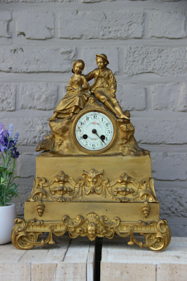 Antique french bronze gold gilt mantel clock Devil putti head couple figurines