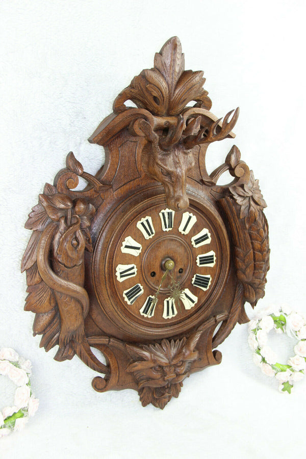 Antique Black Forest wood carved hunting satyr devil head deer fish bird clock