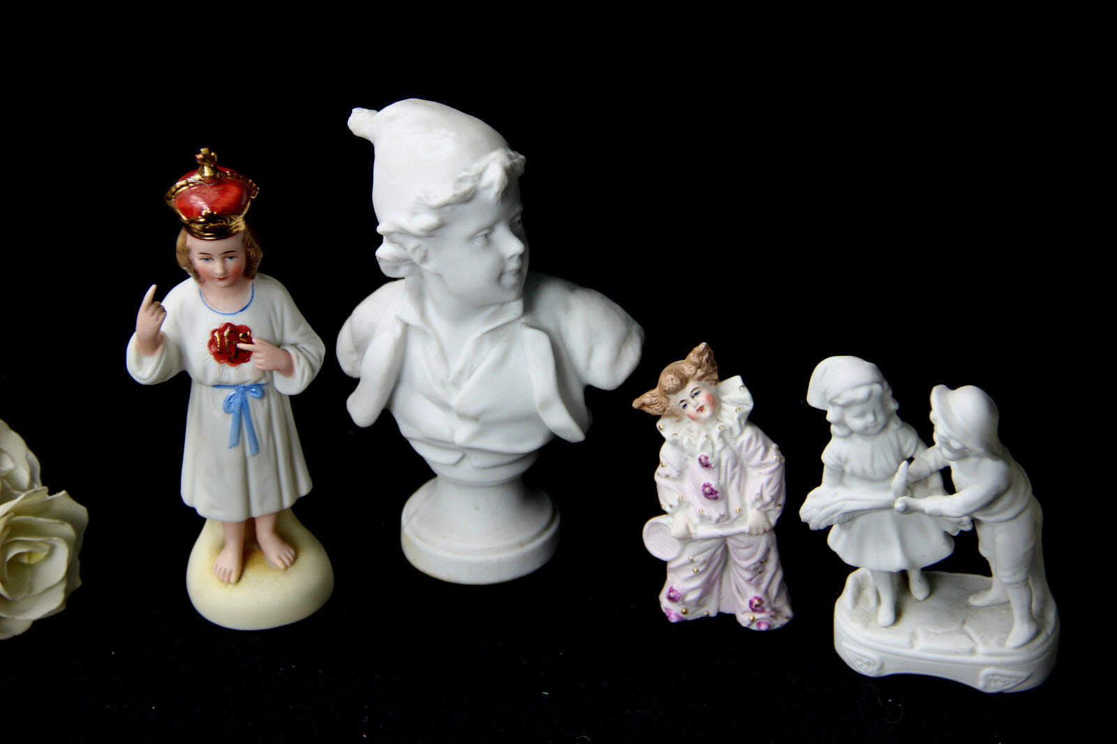 Set of 4 porcelain / bisque statues