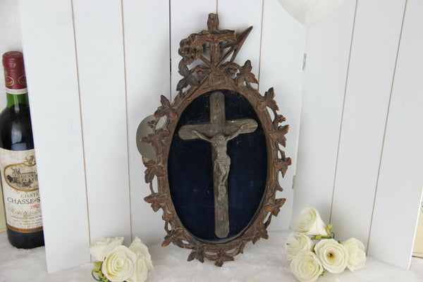 A Large antique napoleon III black forest wood carved crucifix velvet floral