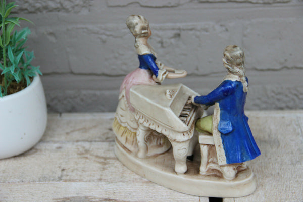 Antique german marked porcelain Statue group piano playing figurines
