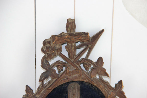 A Large antique napoleon III black forest wood carved crucifix velvet floral