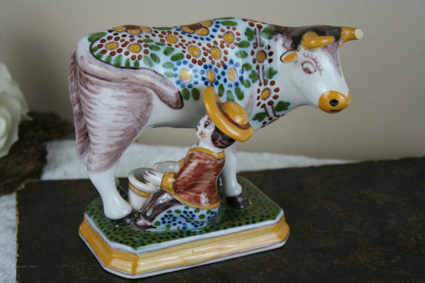 Dutch polychrome Makkum tichelaar marked girl milking cow pottery figurine