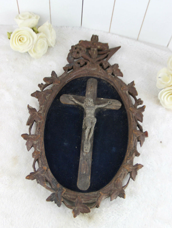 A Large antique napoleon III black forest wood carved crucifix velvet floral