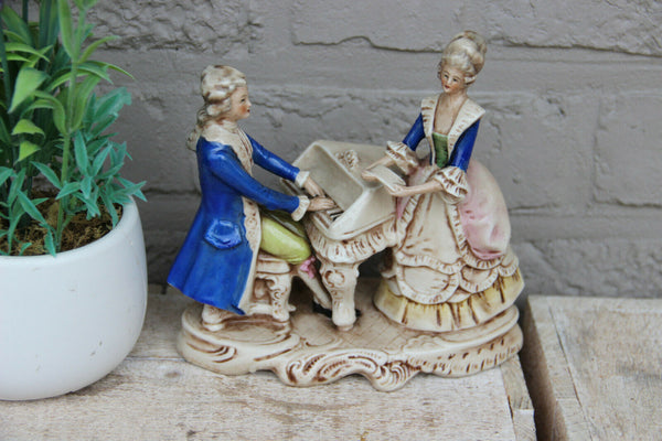 Antique german marked porcelain Statue group piano playing figurines