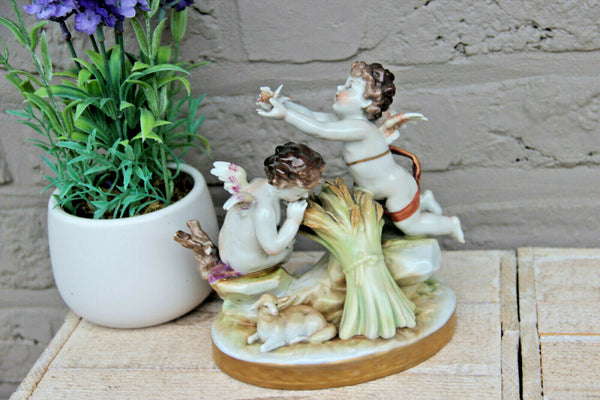 Antique German Volkstedt porcelain marked putti group figurine statue bird