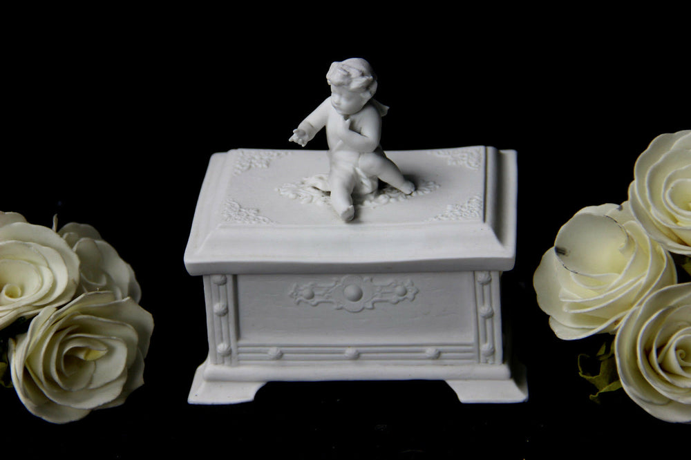 German Bisque porcelain marked Putti lidded box jewelry