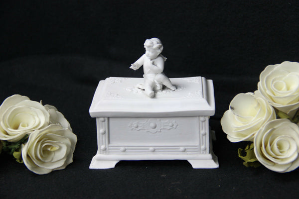 German Bisque porcelain marked Putti lidded box jewelry