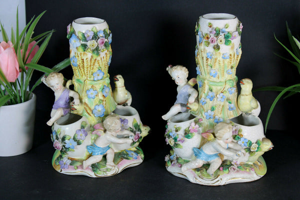 PAIR French porcelain faience putti angels cherub birds statue