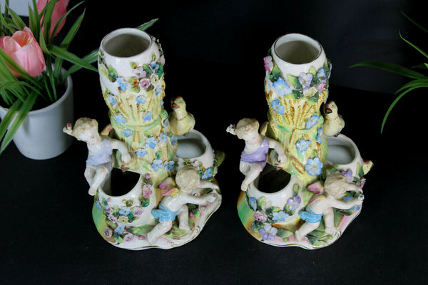 PAIR French porcelain faience putti angels cherub birds statue