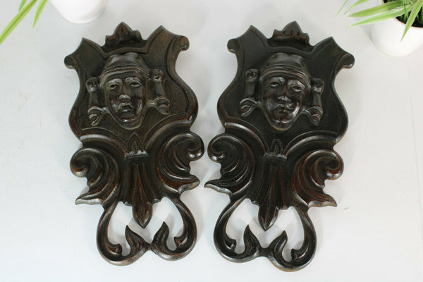 pair antique breton wood carved black lacquered portrait heads wall plaques