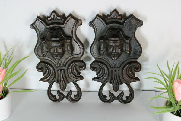 pair antique breton wood carved black lacquered portrait heads wall plaques
