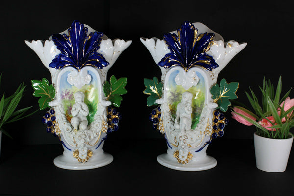 Antique pair vieux paris porcelain boy girl figural Floral vases 1900s