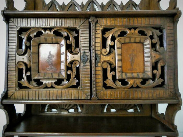 Antique German black forest wood carved apothecary wall cabinet man lady fig