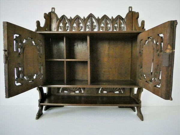 Antique German black forest wood carved apothecary wall cabinet man lady fig