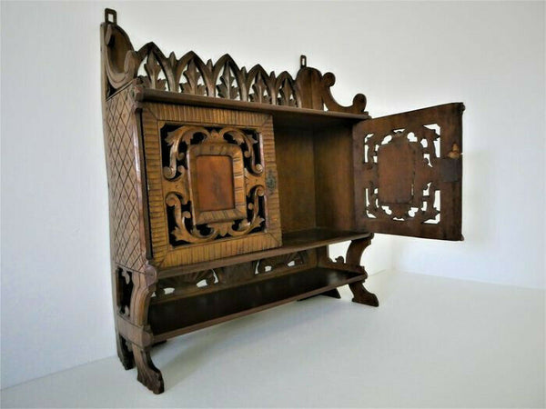 Antique German black forest wood carved apothecary wall cabinet man lady fig