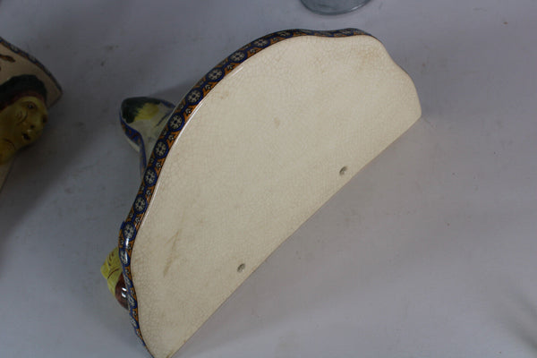 PAIR GIEN Faience mythological putti cherub scene caraytid head wall consoles