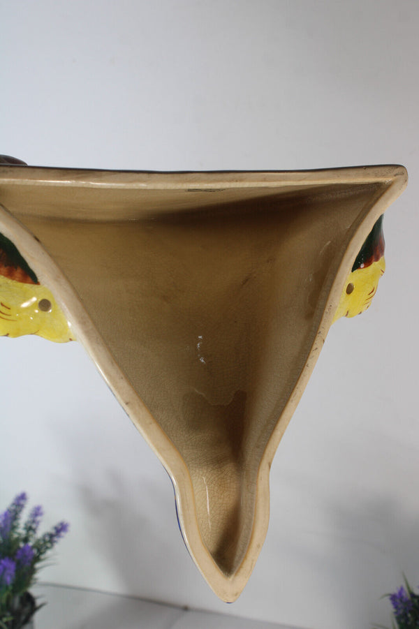 PAIR GIEN Faience mythological putti cherub scene caraytid head wall consoles