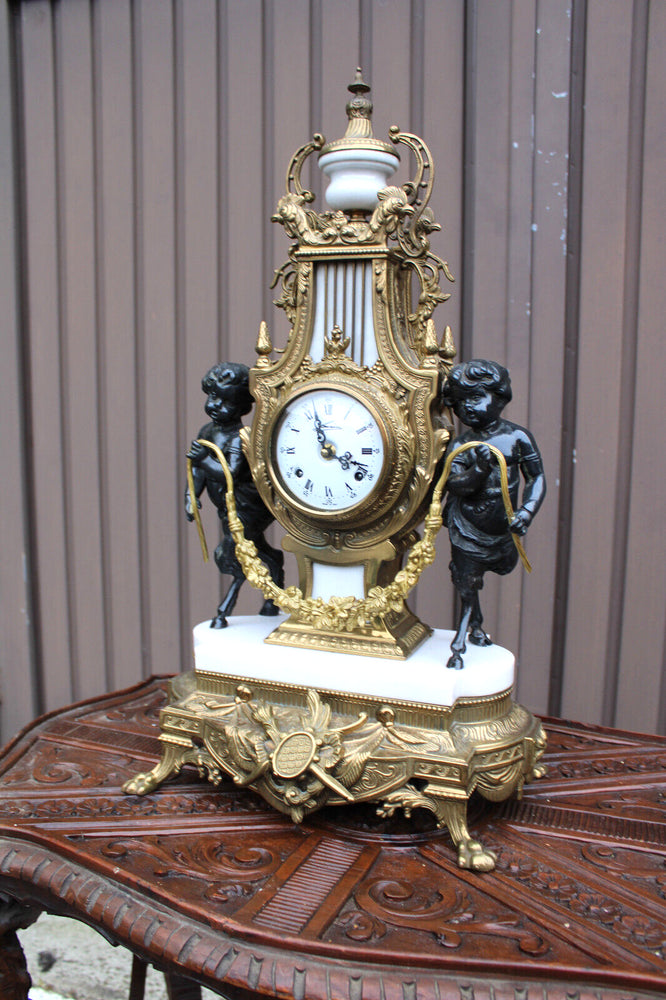 Vintage bronze marble white faun putti cherub figural mantel clock