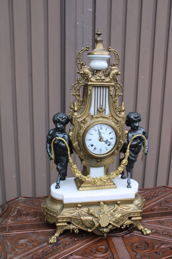 Vintage bronze marble white faun putti cherub figural mantel clock