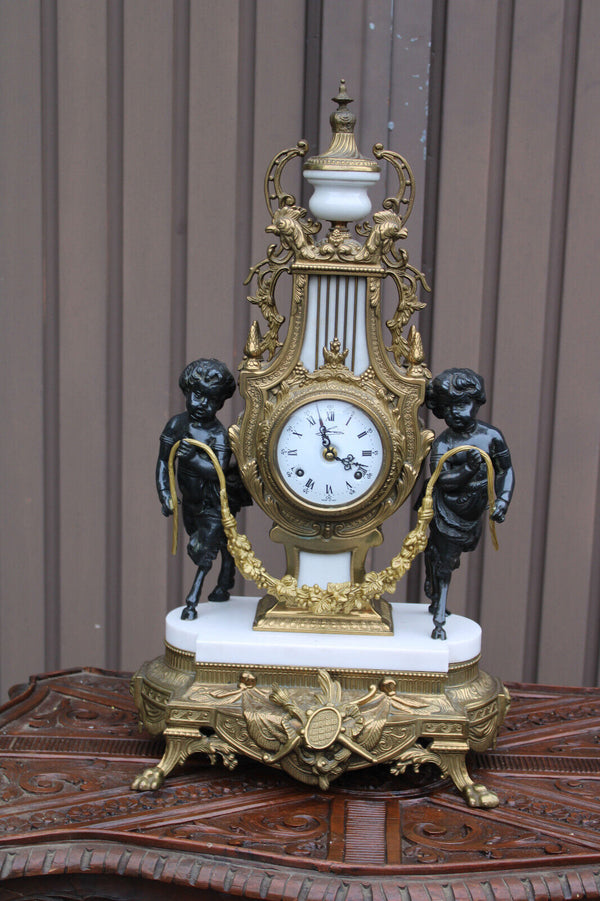 Vintage bronze marble white faun putti cherub figural mantel clock
