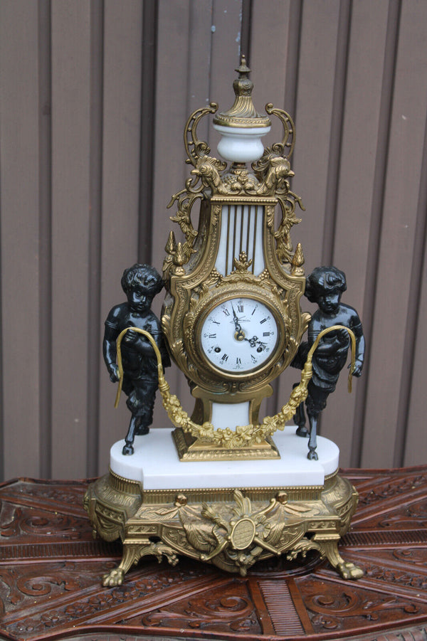 Vintage bronze marble white faun putti cherub figural mantel clock