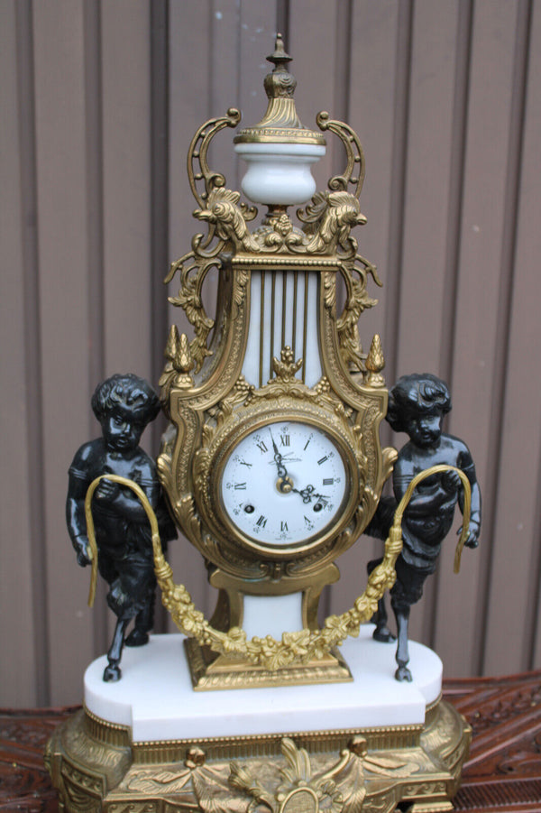 Vintage bronze marble white faun putti cherub figural mantel clock
