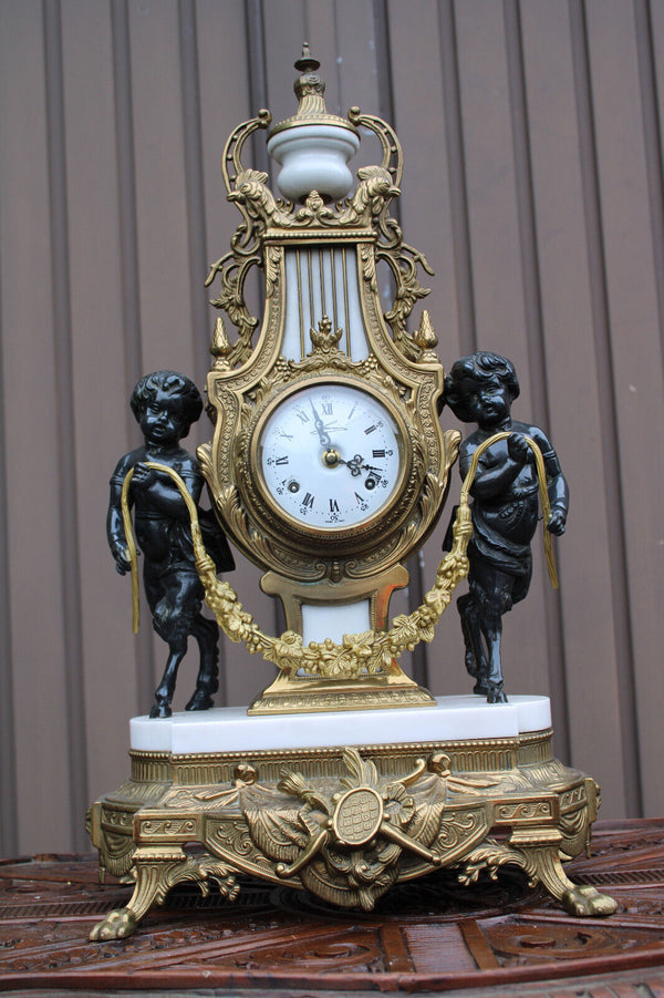 Vintage bronze marble white faun putti cherub figural mantel clock