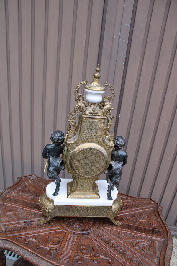 Vintage bronze marble white faun putti cherub figural mantel clock