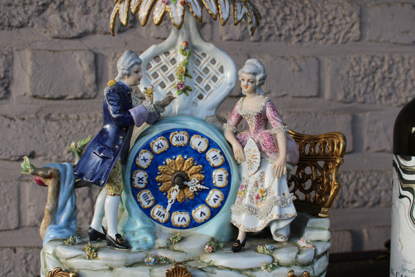 Gorgeous porcelain mantel clock romantic couple palm tree 1970