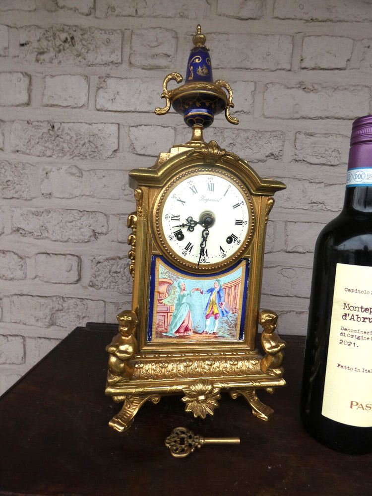 Vintage bronze porcelain putti cherub mantel clock fhs movement