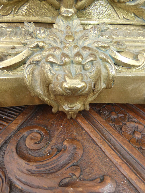 Antique bronze lion heads mantel clock