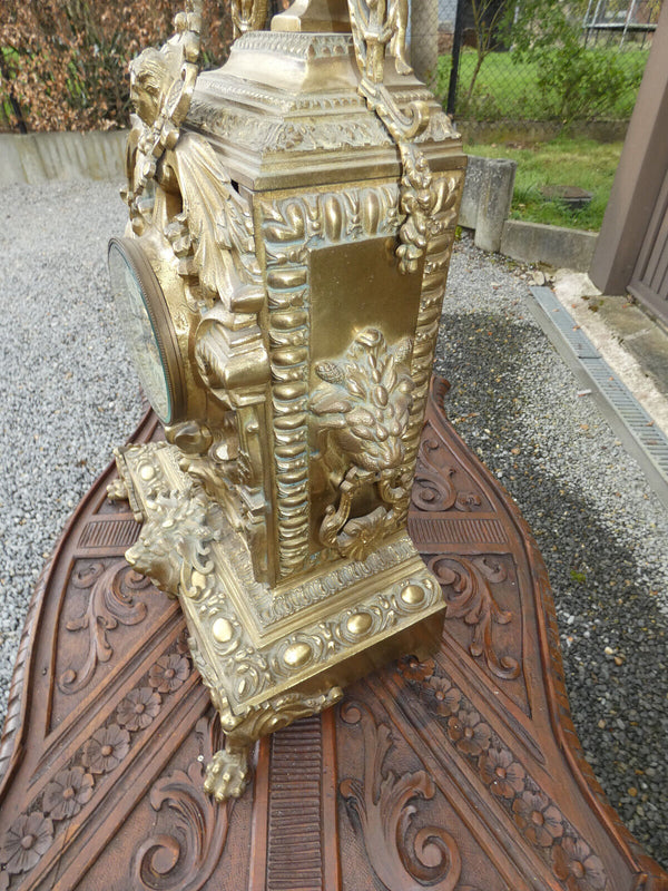 Antique bronze lion heads mantel clock