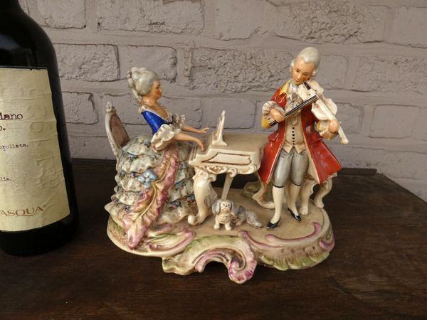 German Grafenthal marked porcelain statue music playing dog