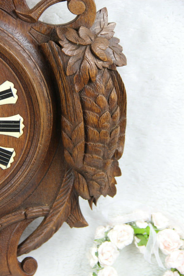Antique Black Forest wood carved hunting satyr devil head deer fish bird clock