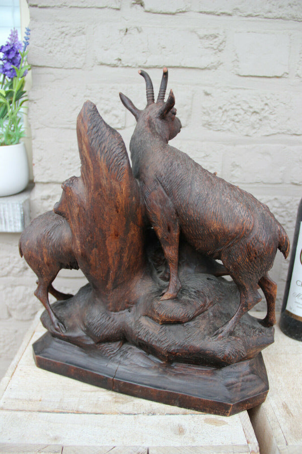 Large German black Forest wood carved capricorn deer group statue 19thc