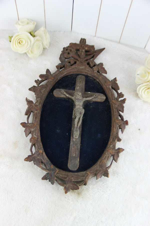 A Large antique napoleon III black forest wood carved crucifix velvet floral