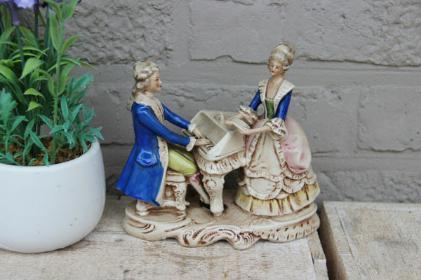 Antique german marked porcelain Statue group piano playing figurines