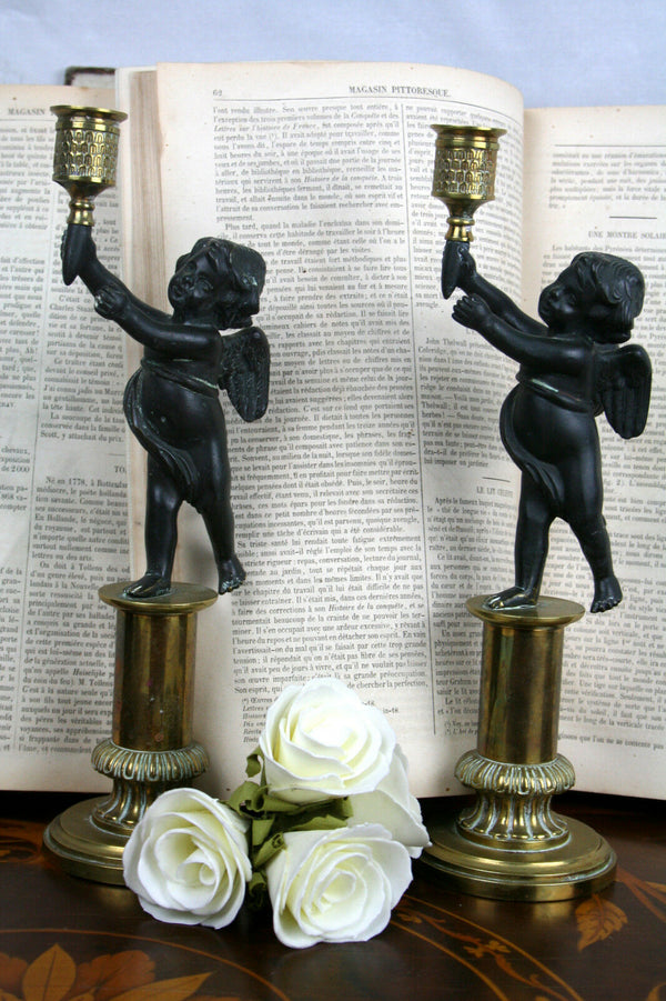 Pair Exclusive 19thc Patinated Bronze and Parcel Gilt Putti-form Candlesticks