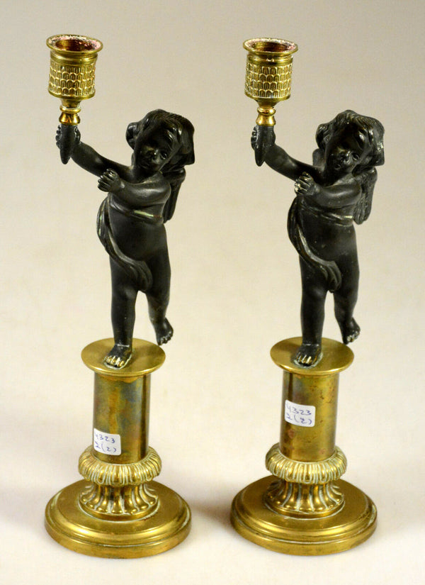 Pair Exclusive 19thc Patinated Bronze and Parcel Gilt Putti-form Candlesticks