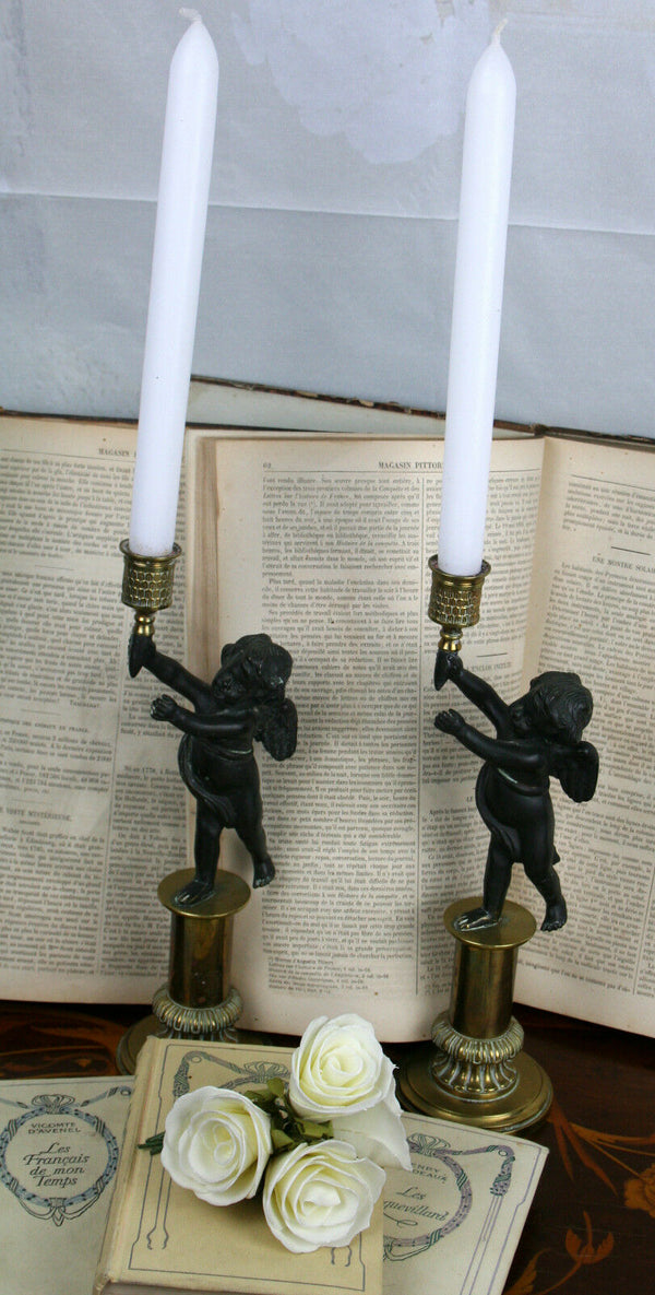 Pair Exclusive 19thc Patinated Bronze and Parcel Gilt Putti-form Candlesticks