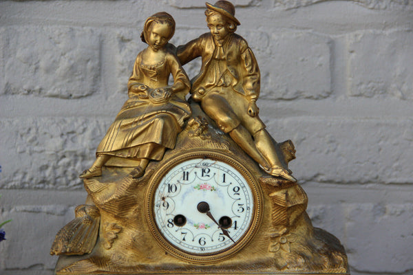Antique french bronze gold gilt mantel clock Devil putti head couple figurines