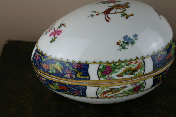 A large Easter Egg lidded box in Limoges marked porcelain with birds floral